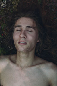 Portrait of young man lying down