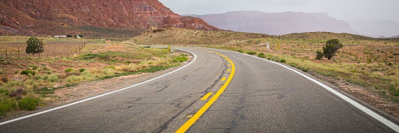 Country road leading towards mountains