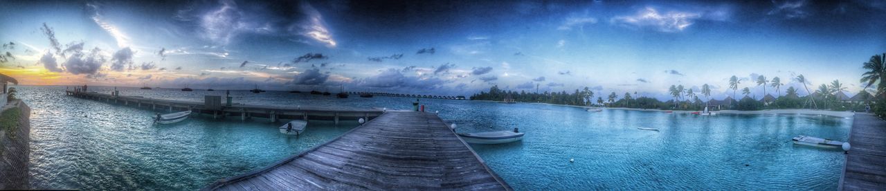 water, sky, cloud - sky, tranquil scene, blue, tranquility, panoramic, pier, scenics, beauty in nature, cloud, nature, reflection, lake, sea, built structure, the way forward, waterfront, outdoors, cloudy