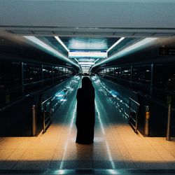 Blurred motion of people in tunnel