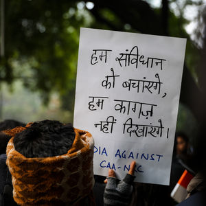 Close-up of text written on cutting board