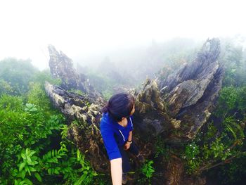 Woman standing on rock formation