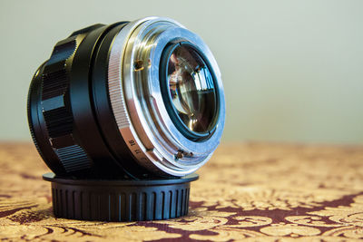 Close-up of camera on table