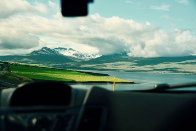 Scenic view of mountains against cloudy sky