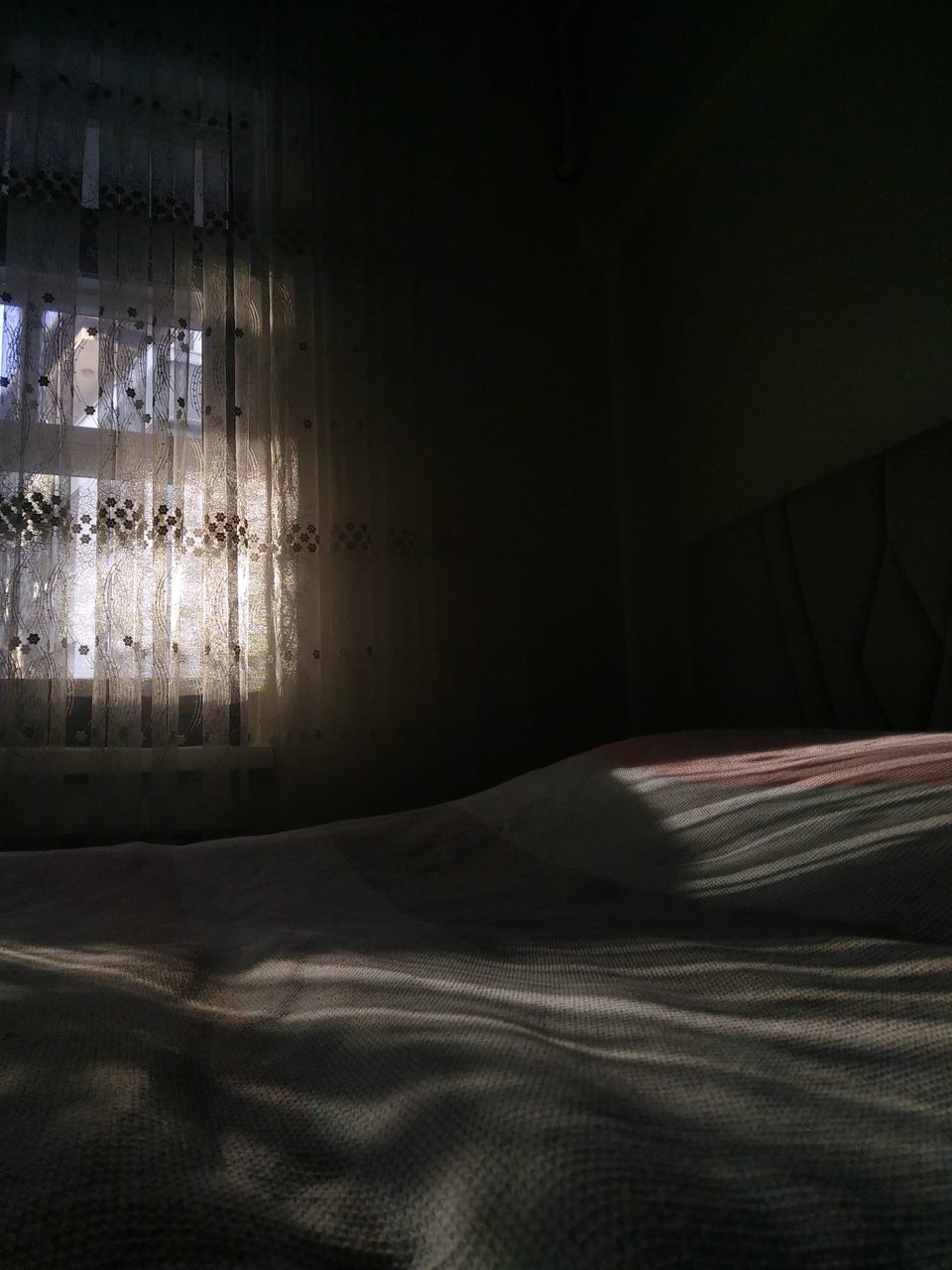 SUNLIGHT FALLING ON BED
