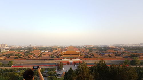 High angle view of buildings against clear sky