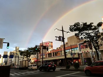 View of rainbow over city street