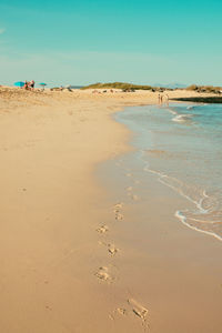 Scenic view of beach against clear sky