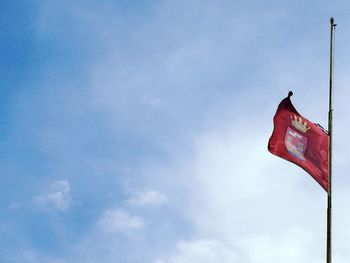 Low angle view of flag against sky