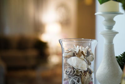 Close-up of white flower vase on table