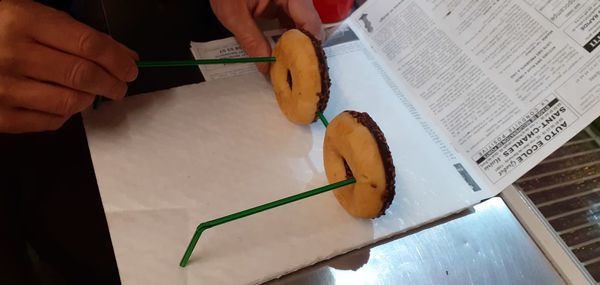 High angle view of man cutting board on table