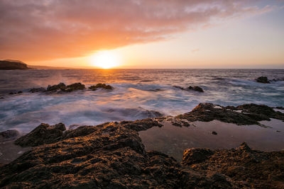 Scenic view of sea against sky during sunset