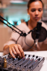 Portrait of woman using calculator