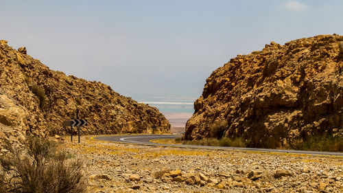 Road by sea against sky