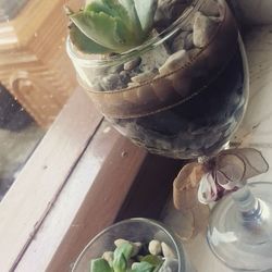 High angle view of glass of jar on table