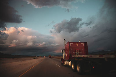 A truck on a long straight road in nevada