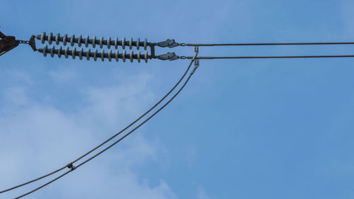 Low angle view of cable against sky