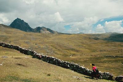 Man on field against sky