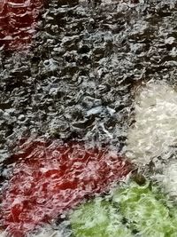 Full frame shot of water flowing through rocks