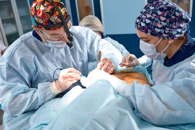 Female doctor examining patient in hospital