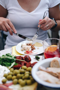 Midsection of man preparing food