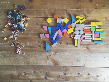 High angle view of toys on wooden floor