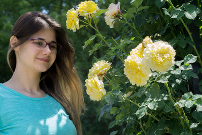 Portrait of woman with yellow flowers