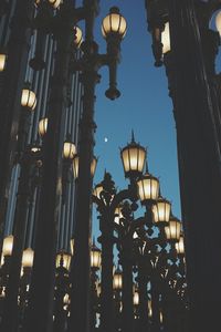 Low angle view of illuminated street light against sky at night