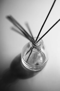 High angle view of incense sticks in container on table