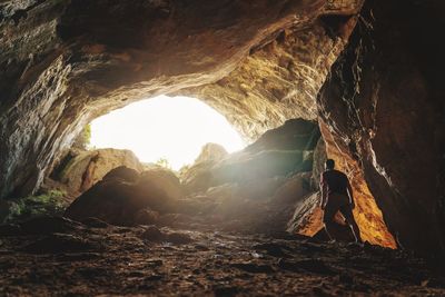 Man standing in cave