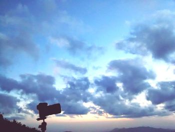 Low angle view of road sign against sky