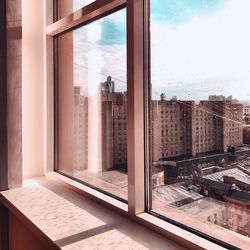 View of cityscape through window