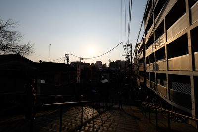 Buildings in city at sunset