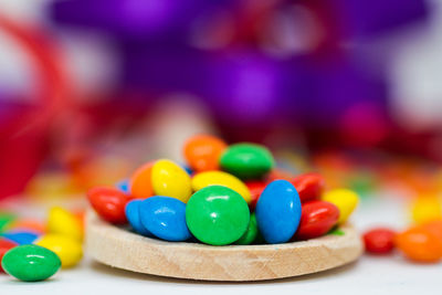 Close-up of multi colored candies on table