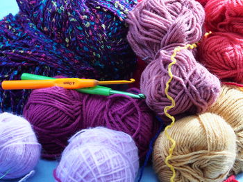 Close-up of knitting equipment on table