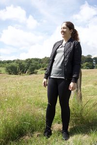 Full length of woman standing on field