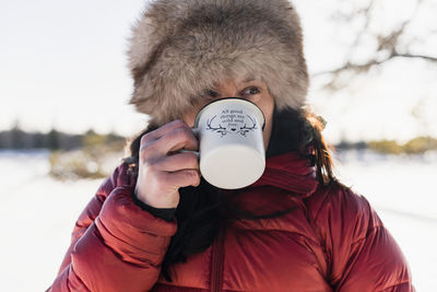 Woman drinking from mug