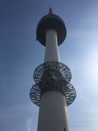 Low angle view of communications tower against sky