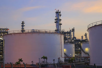 View of factory against sky during sunset