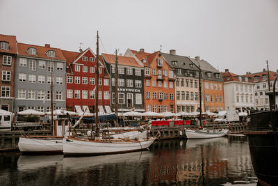 Boats moored at harbor