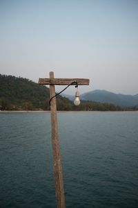 Calm lake with mountain range in background