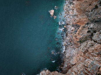 High angle view of rock formations on beach