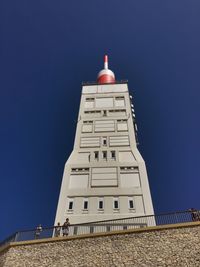 Low angle view of building against clear blue sky