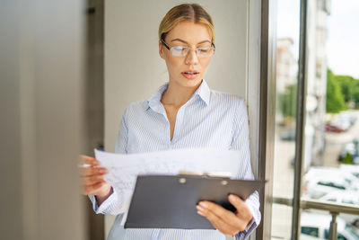 Mid adult woman looking at camera