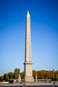 Low angle view of monument against blue sky