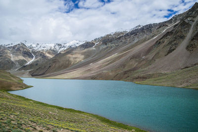 Scenic view of lake and mountains against sky