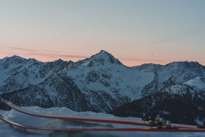 Scenic view of snow covered mountains against sky during sunset