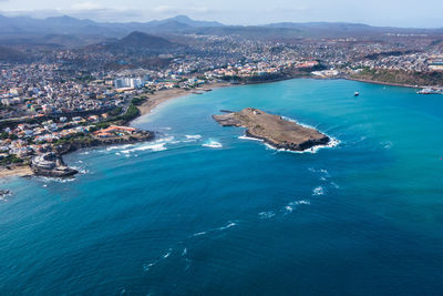 High angle view of townscape by sea