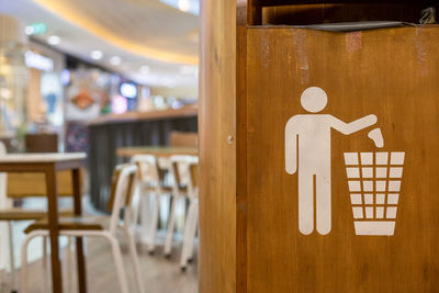 Close-up of empty chairs and table in cafe