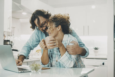 Female friends working at home